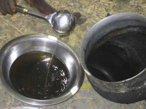 The impurities are scorched off (see edges of the pot), and the warm oil is decanted to a clean bowl and cooled. We would like to see the oil filtered through a clean cloth at this stage.