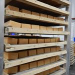 handmade bar soaps on shelves for the curing room
